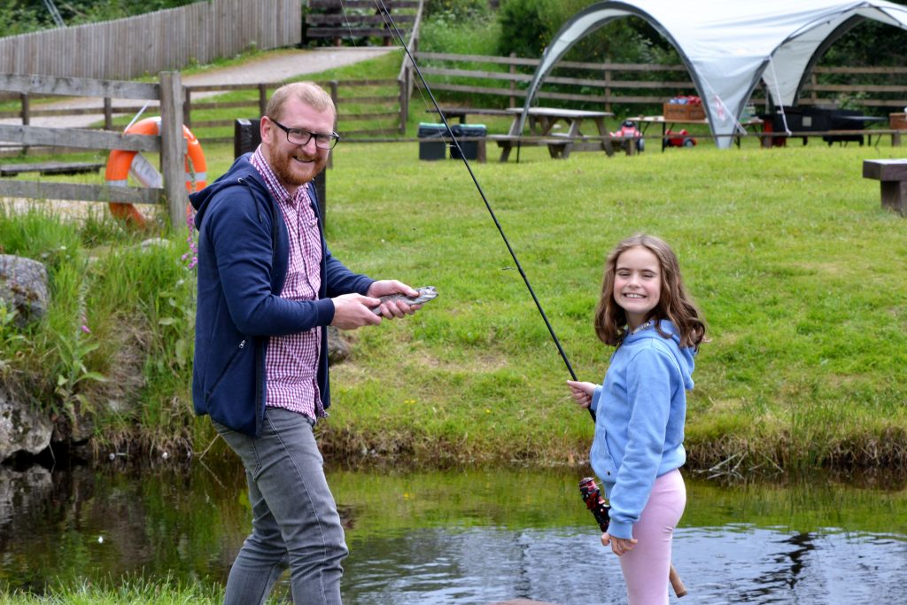 father and daughter fishing at Rothiemurchus